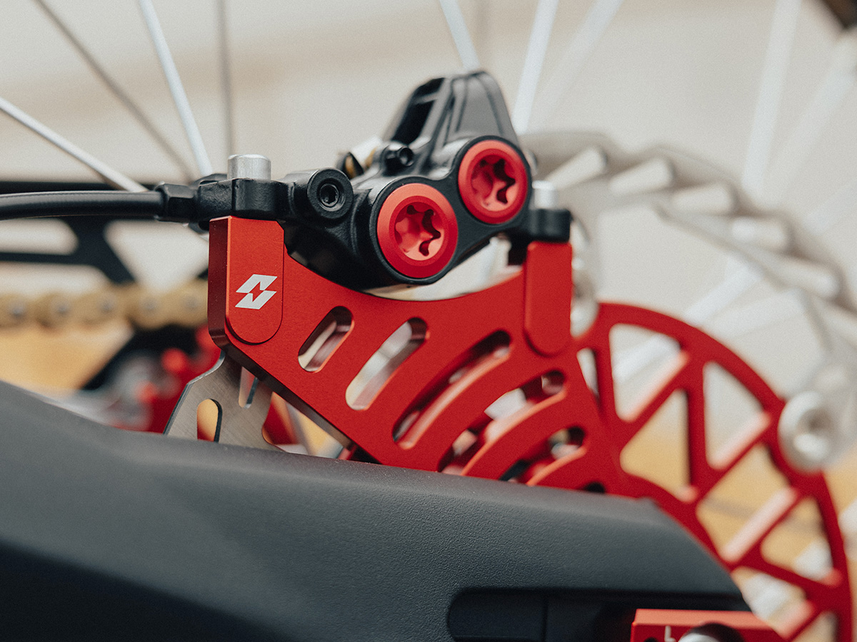 Full-E Charged Rear Brake Caliper Bracket for Talaria / Light Bee 250mm Oversize Brake Disc Red