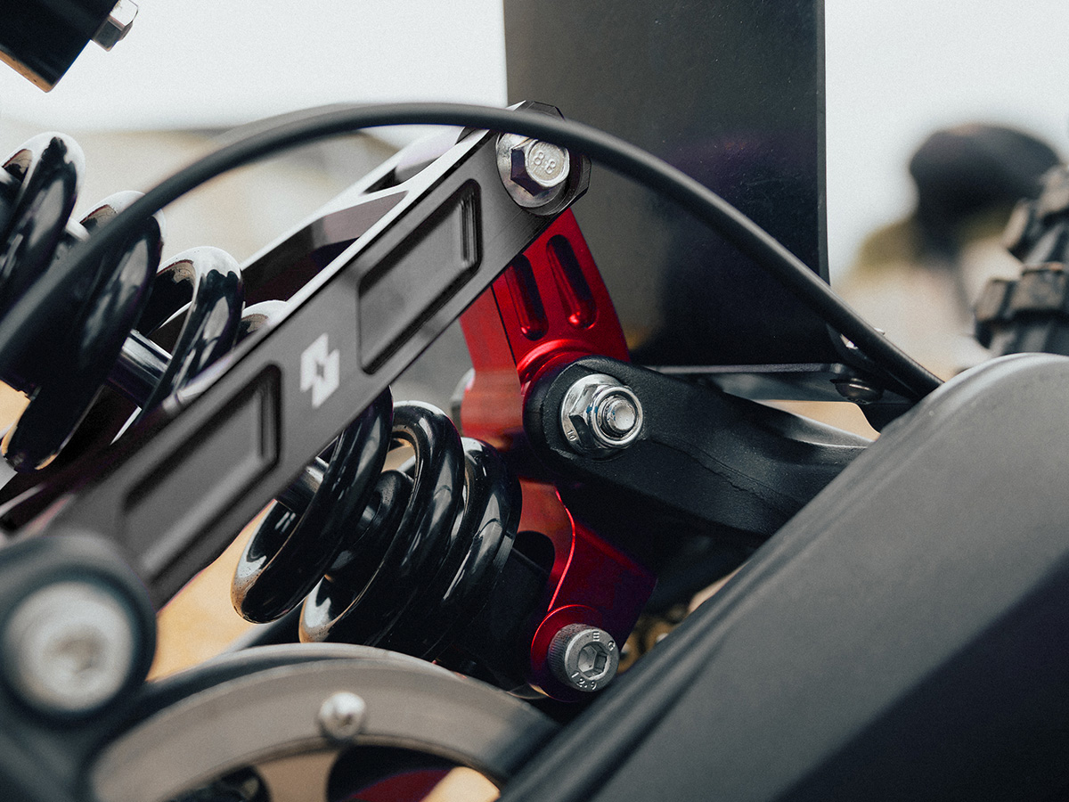 Full-E Charged Reinforced Suspension Linkage With Roller Bearings Red